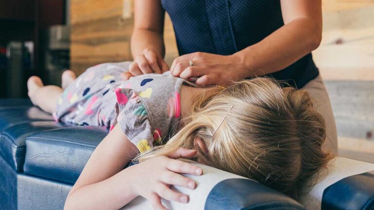 Traveler adjusting lumbar support in a car seat before a long drive, focusing on lower back alignment.